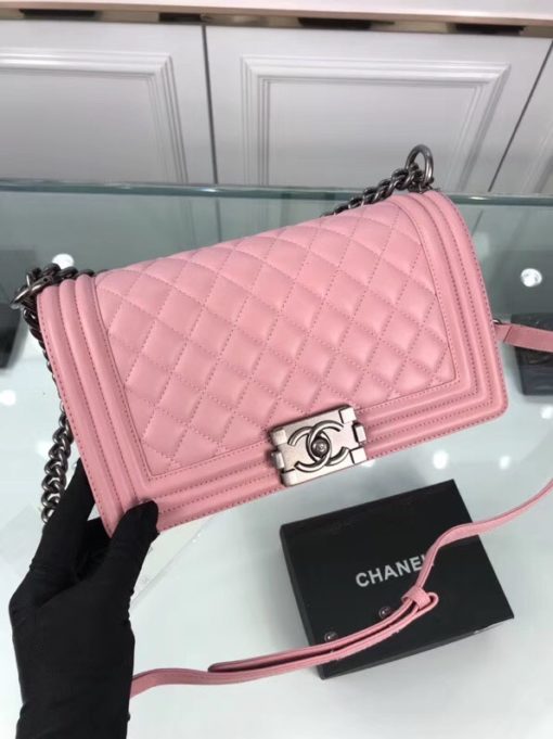 CHANEL 'Boy' Diamond Quilted Leather Flap Bag. Original Quality Bag including gift box, care book, dust bag, authenticity card. Created by Karl Lagerfeld, the iconic design owes its name to Gabrielle Chanel's first love, Boy Capel. This Chanel Boy Flap Bag Quilted is every woman's dream. Crafted from calfskin leather, the bag features Chanel's signature diamond quilting, chunky chain link strap with leather shoulder pad, and metal-tone hardware accents. Its CC Boy logo closure opens to a fabric-lined interior with slip pocket perfect for daily essentials. A sought-after, luxurious accessory. | CRIS&COCO Authentic Quality bags and Accessories