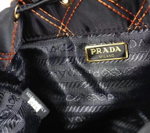 PRADA Quilted Bucket Bag. Original Quality Bag including gift box, care book, dust bag, authenticity card. PRADA nylon bucket bag with tessuto-impunturato quilted topstitching. Leather top handle. Drawstring top. Detachable Shoulder Strap. Front Zip Pocket with logo plate. | CRIS&COCO Authentic Quality bags and Accessories