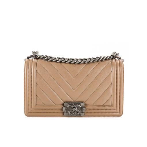 CHANEL Chevron Quilted Leather Flap Bag. Original high quality bag. Authentic design. Original quality printed dust bag and sales box. Created by Karl Lagerfeld, the iconic design owes its name to Gabrielle Chanel's first love, Boy Capel. This Chanel Boy Flap Bag Quilted is every woman's dream. Crafted from calfskin leather, the bag features Chanel's signature chevron quilting, chunky chain link strap with leather shoulder pad, and metal-tone hardware accents. Its CC Boy logo closure opens to a fabric-lined interior with slip pocket perfect for daily essentials. A sought-after, luxurious accessory.| | CRIS&COCO Authentic Quality Designer Bag and Luxury Accessories
