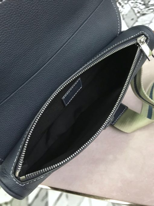 DIOR Men Kim Jones Saddle Leather Bag. Original Quality Bag. Authentic Style. Genuine Calf Leather. Metal Hardware. Authentic Packaging. Original Quality Dust Bag. The iconic DIOR saddle bag made its first appearance at the women’s spring/summer ready-to-wear show in 2000. In December 2018, DIOR MEN designer Kim Jones brought the bag out for his second show in Tokyo, transforming it into an accessory of the future. A real update of the piece, which found its continuation in the autumn/winter 19 collection Dior presented during Paris Fashion Week. | CRIS&COCO | High Quality Designer Handbag