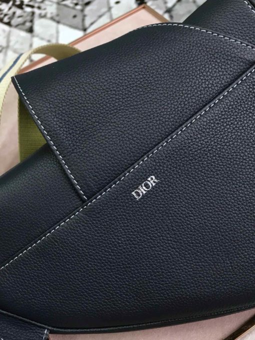 DIOR Men Kim Jones Saddle Leather Bag. Original Quality Bag. Authentic Style. Genuine Calf Leather. Metal Hardware. Authentic Packaging. Original Quality Dust Bag. The iconic DIOR saddle bag made its first appearance at the women’s spring/summer ready-to-wear show in 2000. In December 2018, DIOR MEN designer Kim Jones brought the bag out for his second show in Tokyo, transforming it into an accessory of the future. A real update of the piece, which found its continuation in the autumn/winter 19 collection Dior presented during Paris Fashion Week. | CRIS&COCO | High Quality Designer Handbag