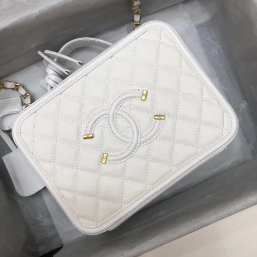 CHANEL Vanity Case Shoulder Bag and Crossbody. Original, authentic quality bag. Genuine Calf Leather. Metal Hardware. Authentic Packaging. Original Quality Dust Bag. Authenticity Card. This iconic CHANEL bag was first released for the Spring-Summer 2016 Collection. Iterations are dropped every new season. This bag is in beautiful grained calfskin leather with brushed metal-tone hardware. It features an embroidered CC stitched logo, a single flat top handle, two hanging clochettes. Its inside is lined with calfskin leather. | CRIS&COCO | High quality designer bags and luxury accessories