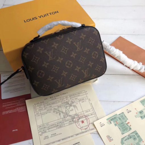 LOUIS VUITTON Saintonge Monogram Canvas Crossbody Bag. Original Quality Bag. Authentic calf leather trim and monogram coated canvas. Gold-toned Hardware. LOUIS VUITTON Sales Box and Dust Bag. Booklet, Authenticity Card, Payment Slip. Monogram canvas and smooth calfskin combine in the Saintonge, a compact bag with a youthful vibe. The leather lends contrast and volume to the design, and the tassels are a playful touch. With its top handle and long strap, the bag can be worn with top handle or as crossbody and shoulder bag. | CRIS&COCO | High quality designer bags and authentic luxury