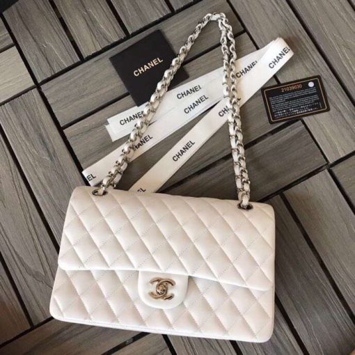 CHANEL Medium Classic Flap Bag. Original Quality Bag. CHANEL Sales Box and Dust Bag. Booklet, Authenticity Card, Payment Slip. Whether you’re a young celeb looking to carry a flashy mini bag in front of the paparazzi or a corporate maven looking for a roomy day bag that announces that you’ve arrived. Many sizes, colors and variations on the Classic Flap mean that there’s likely a version that will suit your purposes. The bags tend to hold their value well for years. | CRIS&COCO | High quality designer bags and authentic luxury