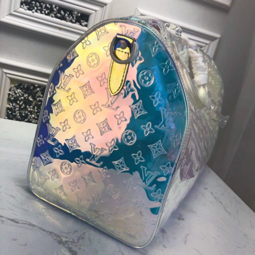 LOUIS VUITTON Monogram PVC Bandouliere 50 Travel Bag x Virgil Abloh. Original Quality Bag. Metal Toned Hardware. LOUIS VUITTON Sales Box and Dust Bag. Booklet, Authenticity Card. This colorful take on the Keepall Bandouliere 50 represents the pioneering vision of menswear artistic director Virgil Abloh: the combination of his youthful vibrancy with the timeless elegance of Louis Vuitton. Made of Monogram-embossed PVC, this generously sized travel bag captures the eye with its bold, iridescent hues. A choice between the removable strap or top handles for carrying ensures versatility. | CRIS&COCO | High quality designer bags and luxury accessories