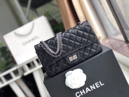 CHANEL 2.55 Reissue Quilted Leather Double Flap Bag | Original Quality Bag. Authentic aged calfskin. Aged Metal Toned Hardware. CHANEL Sales Box and Dust Bag. Booklet, Authenticity Card. In February 2005, Karl Lagerfeld re-made the 2.55, precisely as Coco Chanel had made in 1955, in commemoration of the 50th anniversary of the 2.55. It came to be known as the Reissue. As an homage to Coco's upbringing in an orphanage, the 2.55 was outfitted with a double chain, reminding of the dangled keychains of her caretakers. The brownish-red color of the inside represents the color of the children's uniforms. A zipped compartment on the inside of the front flap was added where Coco would hide her love letters. The back outside flap of the 2.55 Reissue marks where Coco would stash her cash. | CRIS&COCO Authentic Quality Designer Bags and Luxury Accessories