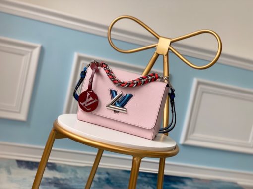 LOUIS VUITTON TWIST Medium Model. Original Quality Bag including gift box, care book, dust bag, authenticity card. For Fall 2019, the Twist MM handbag comes in Epi leather with a braided handle and removable LV Initials charm, echoing the initials of the emblematic LV twist-lock. The luxurious braided handle enables hand-carry whilst the removable leather strap allows the Twist to be carried over the shoulder or cross-body. | CRIS&COCO Authentic Quality Designer Bags and Luxury Accessories