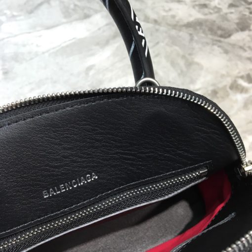 BALENCIAGA Mini Ville Logo Leather Bag. Original Quality Bag. Authentic Epi leather. Metal Toned Hardware. BALENCIAGA Sales Box and Dust Bag. Authenticity Card. BALENCIAGA's Ville mini bowling bag is crafted of grained calfskin printed with a large statement logo at the front and back. This design works as a zipped-top construction with a padlock charm to ensure your valuables are securely stowed. The versatile style can be carried by its rolled handles or over the shoulder via a detachable flat strap. | CRIS&COCO Authentic Quality Designer Bags and Luxury Accessories