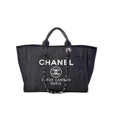 New Small CHANEL Deauville Tote. Authentic Quality Bag with literature, dust bag, gift box and authenticity card, payment slip. This is an original quality CHANEL Denim Canvas Small Deauville Tote. This lovely and best-selling tote is crafted in fine denim canvas printed with a CHANEL stitched logo. The bag features metal threaded chain shoulder straps with leather shoulder pads, canvas trim, and an open top. The bag opens to a spacious fabric interior with zipper and patch pockets. Enjoy this timeless style for everyday needs and shopping.| CRIS&COCO Authentic Quality bags and Accessories