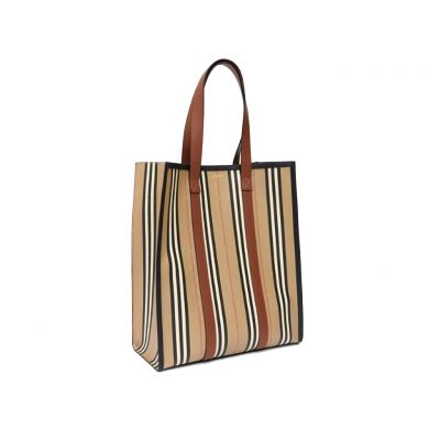 BURBERRY Icon Stripe E-Canvas Portrait Tote Bag. Authentic Quality Bag with literature, gift box, dust bag and authenticity card. A tote bag in environmentally conscious e-canvas, primarily made using renewable resources that require less water and generate less CO2 than conventional coated canvases. The style is printed with our Icon stripe and finished with smooth leather handles. | CRIS&COCO Authentic Quality Designer Bags and Luxury Accessories