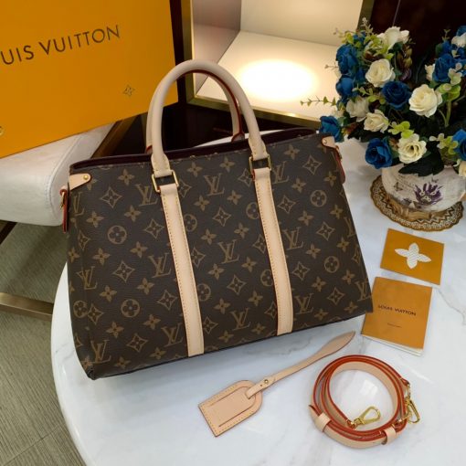 LOUIS VUITTON Soufflot. High-end quality bag including gift box, literature, dust bag, authenticity card. Made from Monogram canvas and featuring two lateral leather bands inspired by the iconic Keepall, the new Soufflot MM has a spacious, well-organized interior. It can be carried by hand and on the elbow with its articulated leather top handles, or on the shoulder, thanks to its removable and adjustable shoulder strap. | CRIS&COCO Authentic Quality Designer Bags and Luxury Accessories
