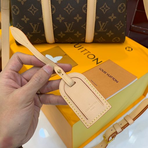 LOUIS VUITTON Soufflot. High-end quality bag including gift box, literature, dust bag, authenticity card. Made from Monogram canvas and featuring two lateral leather bands inspired by the iconic Keepall, the new Soufflot MM has a spacious, well-organized interior. It can be carried by hand and on the elbow with its articulated leather top handles, or on the shoulder, thanks to its removable and adjustable shoulder strap. | CRIS&COCO Authentic Quality Designer Bags and Luxury Accessories