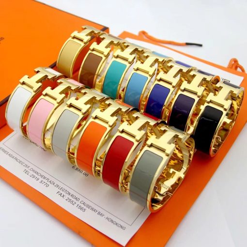 HERMÈS Clic H Bracelet. Narrow bracelet in enamel with gold plated hardware. Authentic quality bracelet with gift box, literature, authenticity card.| Cris and Coco authentic quality designer bags and luxury accessories