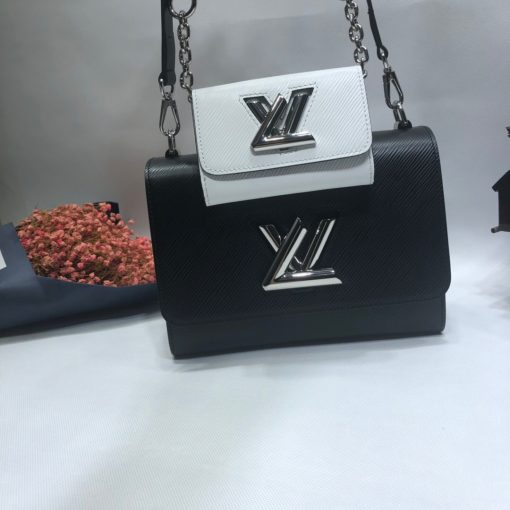 LOUIS VUITTON Twist MM And Twisty Bag. Authentic Quality Bag including gift box, literature, dust bag, authenticity card. Charm Bags are so fashionable right now. The Twist Bag has become LOUIS VUITTON’s top seller. It is now as famous as the Speedy bag. For this season, the house created a mini charm twist bag and attached it right in the center as extra storage. This charm can be detached and used in another bag. The mini Twist Bag is called Twisty and it is for carrying cards, coins, and more. | Cris and Coco High end bags and luxury accessories.