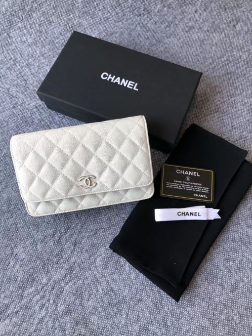 CHANEL Classic Wallet on Chain. Authentic Quality Wallet, including gift box, literature, dust bag, authenticity card. Classic and elegant, a Chanel bag is a fashion statement to your outfit, as seen in this caviar leather flap wallet on chain. Featuring a diamond quilted finish, metal-tone hardware, a foldover top, an internal zipped pocket, an internal slip pocket, an internal logo stamp, a back slip pocket, tortoiseshell details, and a CC turn-lock fastening. | CRIS AND COCO Authentic Quality Designer Bags and Luxury Accessories