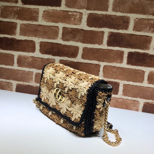 GUCCI GG Marmont Raffia small shoulder bag. Authentic Quality Bag, including gift box, literature, dust bag, authenticity card. An introduction to the GG Marmont line, the small shoulder bag is introduced in the season's coveted raffia effect fabric. An unexpected take on the signature style blends the Double G emblem with the seasonal fabric, reworked to create a textured floral motif that is accented by a black trim and leather details. New shapes and signature Gucci lines are reimagined in a mix of fabrics and trims imbued with an inherent summer feel. | CRIS&COCO Authentic Quality Designer Bag and Luxury Accessories
