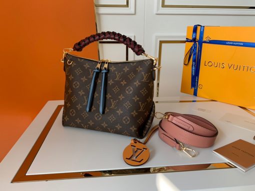 LOUIS VUITTON Beaubourg Hobo Mini Handbag. Authentic Quality Bag, including gift box, literature, dust bag, authenticity card. The adorable Beaubourg Hobo Mini handbag in Monogram canvas comes with a stylishly braided top handle. The House’s exceptional leather craftsmanship can be seen in the hand-painted edge dyeing on the braids. The oversized LV charm adds a sophisticated touch while the colorful name tag and shoulder strap bring a playful feel. This is an excellent handbag, ideal for day wear. | Cris and Coco Authentic Quality Designer Bags and Luxury Accessories