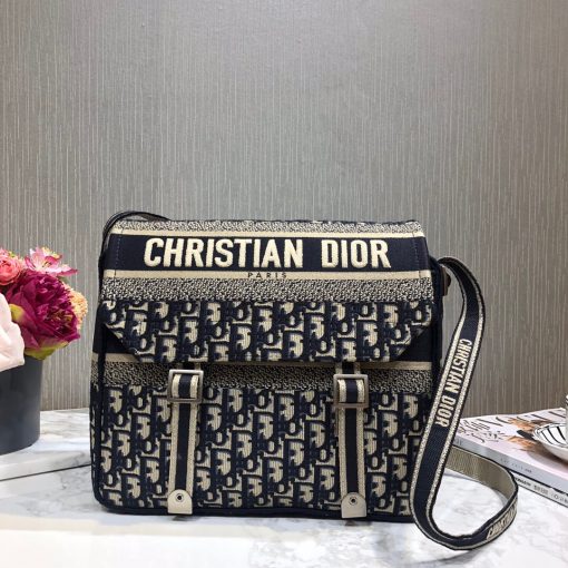 DIOR Oblique Embroidery Camp Bag. Original Quality Bag including gift box, literature, dust bag, authenticity card. This messenger bag is finely crafted of Dior Oblique monogram canvas. The bag features a canvas shoulder strap and aged silver hardware. The flap opens to a matching fabric interior with plenty of space. This a stunning DIOR bag for just your essentials. | CRIS&COCO Authentic Quality Designer Bag and Luxury Accessories