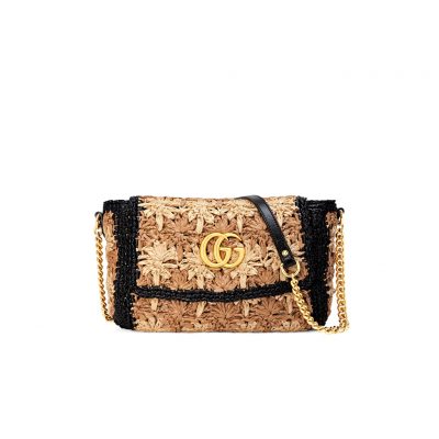 GUCCI GG Marmont Raffia small shoulder bag. Authentic Quality Bag, including gift box, literature, dust bag, authenticity card. An introduction to the GG Marmont line, the small shoulder bag is introduced in the season's coveted raffia effect fabric. An unexpected take on the signature style blends the Double G emblem with the seasonal fabric, reworked to create a textured floral motif that is accented by a black trim and leather details. New shapes and signature Gucci lines are reimagined in a mix of fabrics and trims imbued with an inherent summer feel. | CRIS&COCO Authentic Quality Designer Bag and Luxury Accessories