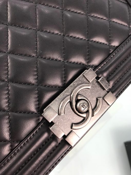CHANEL Boy Quilted Leather Flap Bag. Original Quality Bag including gift box, literature, dust bag, authenticity card. This stand-out, enviable CHANEL Boy quilted flap bag features a chunky chain-link strap with shoulder pad, CC Boy logo push-lock closure, and antiqued hardware accents. Its push-lock closure opens to a black fabric-lined interior with side zip and slip pockets to secure daily essentials. | Cris and Coco Designer Bags and Accessories