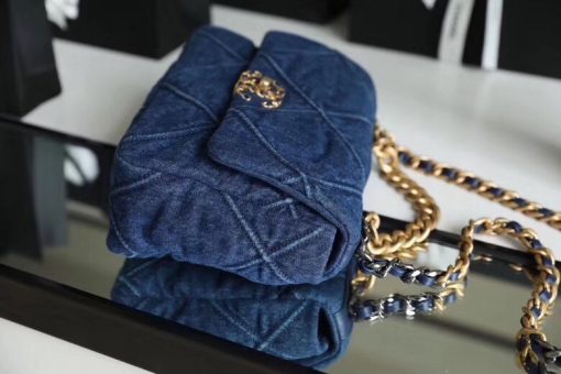 Chanel '19' Flap Bag in Blue Denim 2020. Original Quality Bag including gift box, care book, dust bag, authenticity card. This gorgeous Chanel '19' Flap Bag in Blue Denim is the most sought after bag this year by CHANEL. Gorgeous and so on-trend. Guaranteed authentic and comes with proof of purchase! Please be advised that this is the Larger size, not the medium. Sold out globally. This style is no longer available from Chanel and discontinued in denim. A great investment piece. | CRIS&COCO Authentic Quality Designer Bag and Luxury Accessories