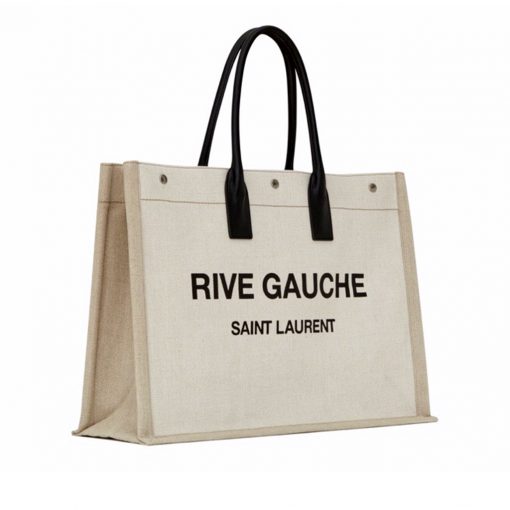 SAINT LAURENT Shopper Leather-Trimmed Printed Canvas Tote. Original Quality Bag including gift box, carebook, dust bag, authenticity card. SAINT LAURENT's 'Shopper' tote is the kind of style we call upon for running errands or weekend market trips. It's made from durable canvas and has soft leather top handles to match the 'Rive Gauche' lettering - it pays homage to the house's original moniker from the '60s. The spacious interior is fitted with a zipped pocket to secure bills and coins. | Cris and Coco Original Quality Designer and Luxury Accessories