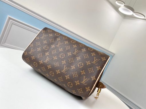 LOUIS VUITTON Speedy 30. Original Quality Bag including gift box, care book, dust bag, authenticity card. Made from iconic Monogram canvas, the LV Speedy 30 is an elegant, compact handbag, a stylish companion for city life. Launched in 1930 as the "Express" and inspired by that era's rapid transit, today’s updated Speedy remains a timeless House icon, with its unmistakable silhouette, rolled leather handles, and engraved, signature padlock. | CRIS&COCO Authentic Quality Bags and Luxury Accessories