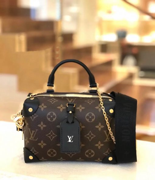 LOUIS VUITTON Petite Malle Souple. Original Quality Bag including gift box, care book, dust bag, authenticity card. The distinctive LV Petite Malle Souple is a soft handbag steeped in House history. The Monogram canvas, riveted leather corners, and leather name tag all evoke LOUIS VUITTON’s legacy as a trunk maker. A gold-color nautical chain and wide removable strap, with LOUIS VUITTON Malletier, embroidered on it, bring up-to-the-minute style. | CRIS AND COCO High Quality Bags and Luxury Accessories