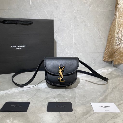 SAINT LAURENT Kaia YSL-Plaque Leather Cross-Body Bag. Original Quality Bag including gift box, care book, dust bag, authenticity card. SAINT LAURENT'S Kaia bag features the label's signature YSL plaque which was sketched by the graphic designer A.M. Cassandre, one of the 20th century's most prominent poster artists. It's crafted from leather to a curved silhouette that's reminiscent of a saddle, then accented by white topstitching. Carry it by the adjustable shoulder strap for contemporary polish. | CRIS and COCO Authentic Quality Designer Bags and Accessories