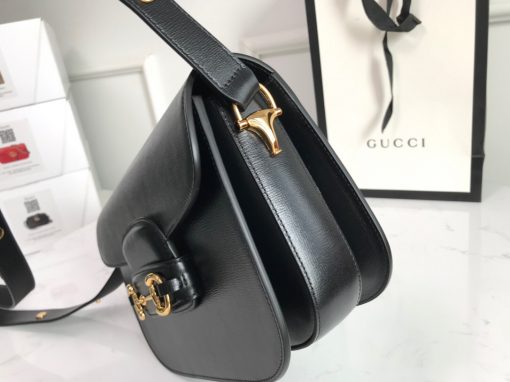 GUCCI 1955 Horsebit Shoulder Bag. High-end quality bag including gift box, literature, dust bag, authenticity card. Introduced for Cruise 2020, the Gucci Horsebit 1955 bag is recreated from an archival design. With the same lines and forms first introduced over six decades ago, the accessory unifies the original details with a modern spirit, highlighting the Horsebit. Part of Gucci’s genetic code, the double ring, and bar design has been established as one of the most distinctive elements among the House symbols borrowed from the equestrian world. Presented on a small flap shoulder bag, the hardware is paired with the House’s monogram fabric and completed with a special mechanism that adjusts the length of the shoulder strap so it can be carried on one shoulder or crossbody. Pieces with versatile ways to wear and style embrace each person who is part of the House’s individual spirit. | Cris and Coco High Quality Bags and Luxury Accessories