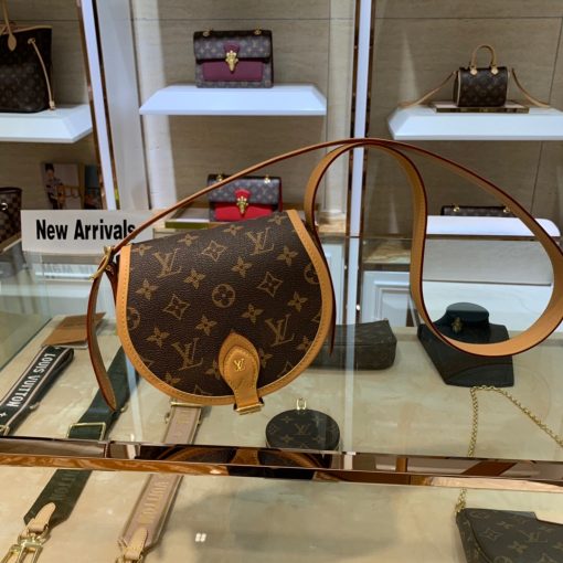 LOUIS VUITTON Tambourin Monogram Crossbody Bag. Original Quality Bag including gift box, care book, dust bag, authenticity card. Nicolas Ghesquière introduces a new version of the versatile and easy-to-wear LOUIS VUITTON Tambourin Monogram Crossbody Bag, made from Monogram canvas and natural cowhide leather. Small and lightweight with a practical inside pocket, this functional bag is ideal for everyday use. It can be worn over the shoulder or cross-body. | CRIS&COCO Authentic Quality Designer Bags and Luxury Accessories