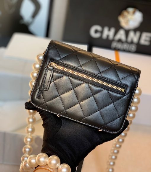 CHANEL Mini Wallet On Chain With Imitation Pearls. Original Quality Wallet including gift box, care book, dust bag, authenticity card. This CHANEL Mini Wallet On Chain With Imitation Pearl comes with an oversized pearl strap. It’s like a dream that comes true. There are so many pearls that keep our heart-melting. And also they’re extremely large pearls as well. | CRIS&COCO Authentic Quality Designer Bags and Luxury Accessories
