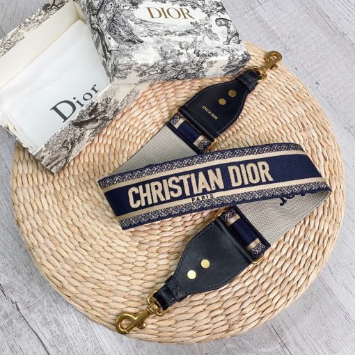 DIOR Christian Dior Shoulder Strap. Original Quality Strap including gift box, care book, dust bag, authenticity card. The 'Christian Dior' signature is featured at the center of the slender shape, framed by black calfskin on either side. Two antique gold-finish metal snap hooks attach the strap to the bag of choice. The strap may be worn over the shoulder or crossbody for a highly personalized style. | CRIS&COCO Authentic Quality Designer Bags and Luxury Accessories