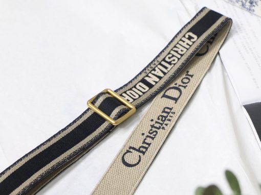 DIOR Christian Dior Shoulder Strap. Original Quality Strap including gift box, care book, dust bag, authenticity card. The 'Christian Dior' signature is featured at the center of the slender shape, framed by black calfskin on either side. Two antique gold-finish metal snap hooks attach the strap to the bag of choice. The strap may be worn over the shoulder or crossbody for a highly personalized style. | CRIS&COCO Authentic Quality Designer Bags and Luxury Accessories