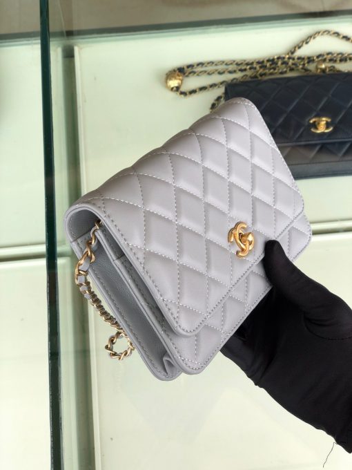 CHANEL Classic WOC Golden Knob Bag. Original Quality Bag including gift box, care book, dust bag, authenticity card. Chanel lends a signature flair to this Classic WOC bag with iconic symbols and construction. Crafted in lambskin, gold-tone hardware, and iconic CC pair together to create the ultimate memorable finish. Open this sweet little quilted bag to find multiple zip and slip pockets for keeping your cards and essentials secure so you can have more fun! | CRIS&COCO Authentic Quality Designer Bags and Luxury Accessories