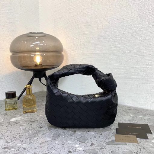 BOTTEGA VENETA The Jodie Hobo Bag. Original Quality Bag including gift box, care book, dust bag, authenticity card. This rounded mini hobo bag in woven leather is woven by hand with a curved, seamless structure. It has Iconic Intrecciato 15 weaves in a subtly amplified new dimension. This bag is soft, draped shape with knot detail on the handle. | CRIS&COCO Authentic Quality Designer Bags and Luxury Accessories