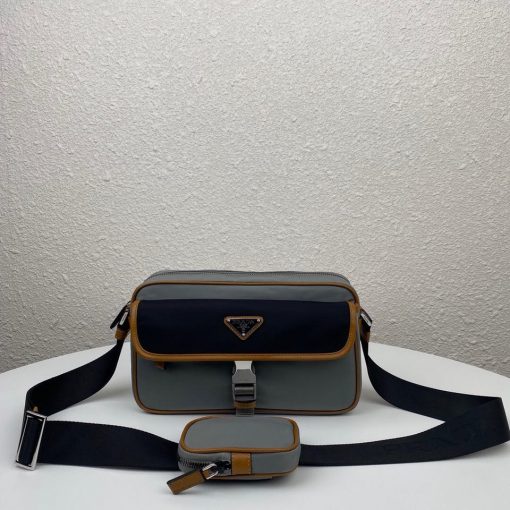 PRADA Nylon Cross-Body Bag. Original Quality Bag including gift box, care book, dust bag, authenticity card. This bag decorated with Saffiano leather trim presents compact volumes and a sleek design. With its distinctive side release buckle on the front, it comes with an easily adjustable shoulder strap. This cross-body bag featuring Saffiano leather trim with metal hardware and Prada logo lining, logo tag inside, enameled metal triangle logo outside. It has a main compartment with zipper, secondary compartment with flap and side release buckle, two front pockets, including one with zipper. | CRIS&COCO Authentic Quality Designer Bags and Luxury Accessories
