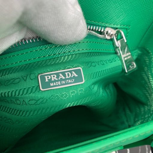 PRADA Galleria Micro Bag. Original Quality Bag including gift box, care book, dust bag, authenticity card. Prada has always been synonymous with transformation and experimentation with new fashion rules. The Prada Galleria bag, an expression of timeless elegance, is made of Prada's iconic Saffiano leather: leather defined by its crosshatch texture and waxed finish. With gimmicky hardware, usual shape and subtle style the bag is perfect for work, and also its truly practical with a shoulder strap. The bag owes its name to the historic Prada store that Mario Prada opened back in 1913 in Galleria Vittorio Emanuele II in Milan. | CRIS&COCO Authentic Quality Designer Bags and Luxury Accessories