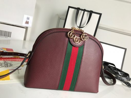 GUCCI Ophidia GG Small Rounded Top Shoulder Bag. Original Quality Bag including gift box, care book, dust bag, authenticity card. This rounded top shoulder bag is a heritage-inspired addition to accessories edit. Complete with the label's signature motifs – GG Supreme print, green and red Web, and golden-tone hardware – it's a perfect modern interpretation of coveted vintage pieces. Carry the runway design with tailored looks for effortless workwear style. | CRIS&COCO Authentic Quality Designer Bags and Luxury Accessories
