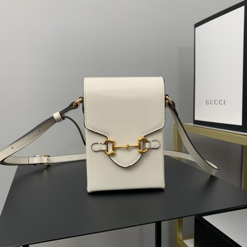 GUCCI Horsebit 1955 Mini Bag. Original Quality Bag including gift box, care book, dust bag, authenticity card. Presented in a petite rectangular shape, this mini bag is introduced for Pre-Fall 2020 in brown leather. Inspired by archival designs, the accessory highlights the double ring and bar design that has been established as one of the most distinctive elements among the House symbols borrowed from the equestrian world. Pieces with versatile ways to wear and style embrace each person who is part of the House’s individual spirit. | CRIS&COCO Authentic Quality Designer Bags and Luxury Accessories