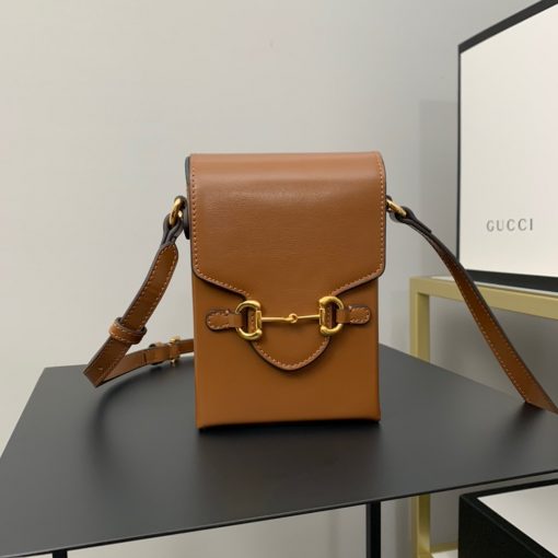 GUCCI Horsebit 1955 Mini Bag. Original Quality Bag including gift box, care book, dust bag, authenticity card. Presented in a petite rectangular shape, this mini bag is introduced for Pre-Fall 2020 in brown leather. Inspired by archival designs, the accessory highlights the double ring and bar design that has been established as one of the most distinctive elements among the House symbols borrowed from the equestrian world. Pieces with versatile ways to wear and style embrace each person who is part of the House’s individual spirit. | CRIS&COCO Authentic Quality Designer Bags and Luxury Accessories