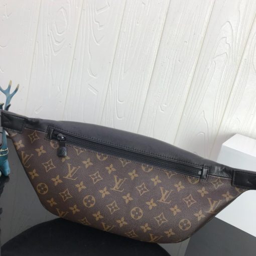 LOUIS VUITTON Discovery Bum Bag. Combining casual sophistication with contemporary practicality, the Discovery Bumbag is the perfect city companion. It is fashioned from Monogram Eclipse canvas/Monogram Shadow leather and adorned with zipped pockets on the front and back for easy access. With its adjustable belt and body-friendly design, it can be worn stylishly slung across the chest, draped over the shoulder or simply strapped around the waist.| CRIS&COCO Authentic Quality Designer Bags and Luxury Accessories