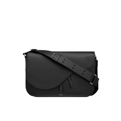 DIOR Saddle Messenger Bag. The Saddle messenger bag is a subtly elegant classic shape. Crafted in black grained calfskin, it is embellished with a flap featuring Saddle lines, and is further enhanced with a 'DIOR' signature. Its adjustable shoulder strap allows it to be worn over the shoulder or crossbody, while the spacious interior is completed with a patch pocket and can hold a 13-inch laptop, documents and a tablet. | CRIS&COCO Authentic Quality Designer Bags and Luxury Accessories