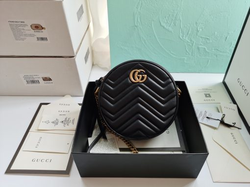 GUCCI GG Marmont Mini Leather Round Shoulder Bag. This Gucci GG Marmont mini round shoulder bag certainly seems to fit the bill! Mini bags are hot this season and we could be more supportive of this trend. This bag from Gucci is only for essentials, the phone will be on your hands, the credit card in your pocket and your lipstick have a 24-hour duration. Crafted from plain/quilted leather, this fun-size accessory has a chain and leather shoulder strap and is adorned with the signature metal GG logo. All the best things come in small packages. Featuring a top zip fastening and gold-tone/silver-tone hardware.| CRIS&COCO Authentic Quality Designer Bags and Luxury Accessories