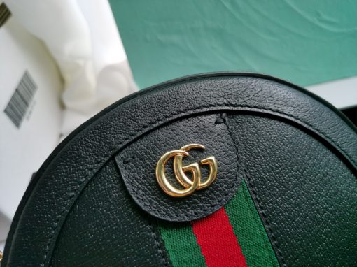 GUCCI GG Marmont Mini Leather Round Shoulder Bag. This Gucci GG Marmont mini round shoulder bag certainly seems to fit the bill! Mini bags are hot this season and we could be more supportive of this trend. This bag from Gucci is only for essentials, the phone will be on your hands, the credit card in your pocket and your lipstick have a 24-hour duration. Crafted from plain/quilted leather, this fun-size accessory has a chain and leather shoulder strap and is adorned with the signature metal GG logo. All the best things come in small packages. Featuring a top zip fastening and gold-tone/silver-tone hardware.| CRIS&COCO Authentic Quality Designer Bags and Luxury Accessories