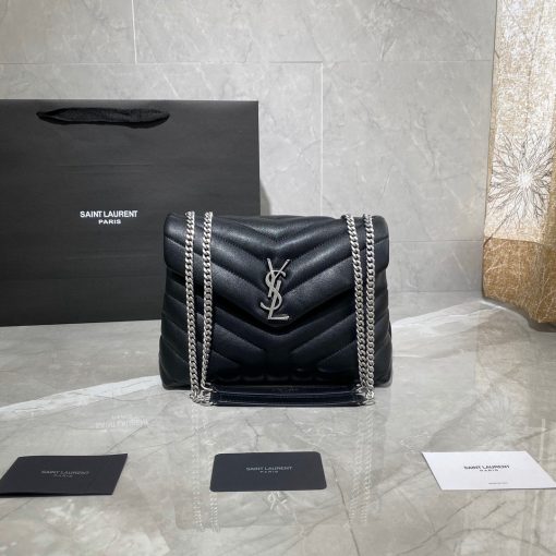 SAINT LAURENT Small Loulou Matelassé Bag. If asked to describe the design of the SAINT LAURENT Small Loulou Matelassé Bag in a few words, we’d say that it is a feminine bag with a slight rock and roll feel to it. One of the most noticeable things about the look of the LouLou is the padded quilted leather, a feature which gives the bag more volume. The leather padded chain handles and the metal interlocking YSL initials on the front flap, make it a bold, yet still classic, luxury handbag. Versatility is another strong point of the YSL LouLou bag, and it can definitely be dressed up or down for any occasion. The chain strap is moveable, which means it can also be worn as a crossbody bag. | CRIS&COCO Authentic Quality Designer Bags and Luxury Accessories