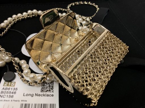 CHANEL Long Necklace. This CHANEL Long Necklace- Gold, Black & Pearly White is part of the Spring-Summer 2021 fashion collection. The artistry and craftsmanship of the House of CHANEL.| CRIS&COCO Authentic Quality Designer Bags and Luxury Accessories