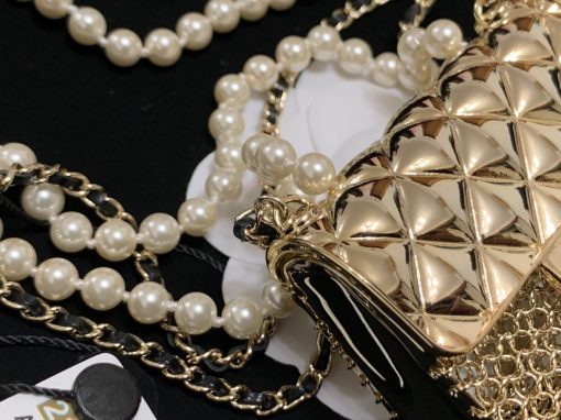 CHANEL Long Necklace. This CHANEL Long Necklace- Gold, Black & Pearly White is part of the Spring-Summer 2021 fashion collection. The artistry and craftsmanship of the House of CHANEL.| CRIS&COCO Authentic Quality Designer Bags and Luxury Accessories