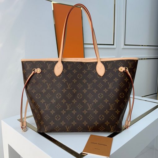 LOUIS VUITTON Neverfull MM.  Original Quality Bag including gift box, care book, dust bag, authenticity card. The Neverfull MM tote unites timeless design with heritage details. Made from supple Monogram canvas with natural cowhide trim, it is roomy yet not bulky, with side laces that cinch for a sleek allure or loosen for a casual look. Slim, comfortable handles slip easily over the shoulder or arm. Lined in colorful textile, it features a removable pouch which can be used as a clutch or an extra pocket. | CRIS&COCO Authentic Quality Designer Bags and Luxury Accessories