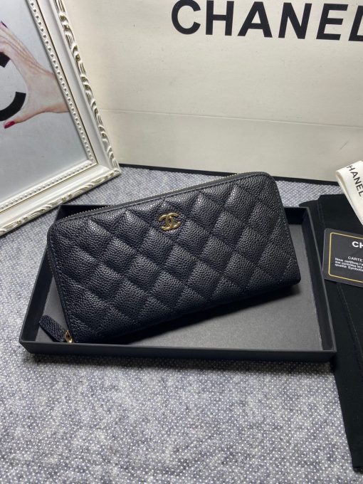 CHANEL Classic Long Zipped Wallet.  Original Quality Wallet including gift box, care book, dust bag, authenticity card. This wallet is one of the signature wallets of Chanel. It has been around for some time now and it will continue to stick around. This wallet is practical and amazing; perfect to hold paper money, credit cards and coins. The classic black color, you will get the signature burgundy colored interior. | CRIS&COCO Authentic Quality Designer Bags and Luxury Accessories